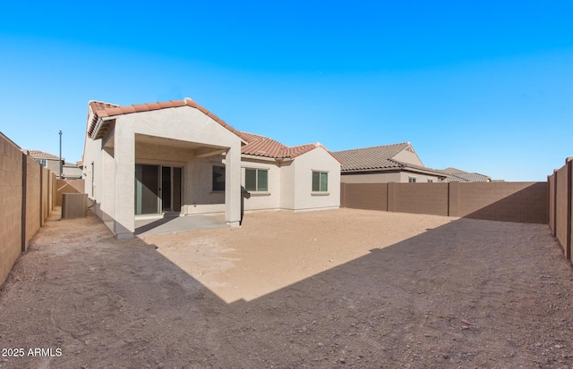 rear view of property featuring a patio area