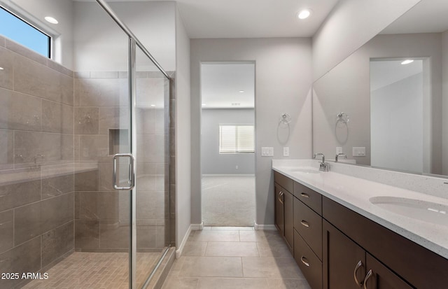 bathroom featuring vanity, tile patterned floors, and walk in shower