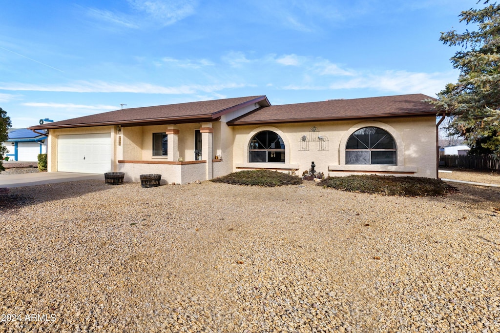 ranch-style house featuring a garage