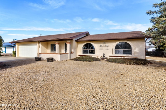 ranch-style house featuring a garage