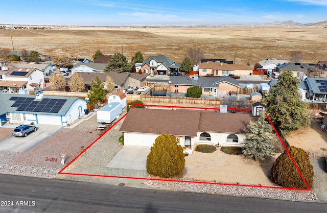 birds eye view of property with a mountain view