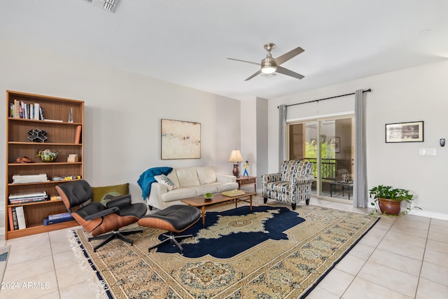 tiled living room featuring ceiling fan