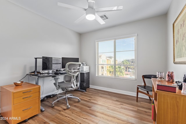 office with ceiling fan and light hardwood / wood-style floors