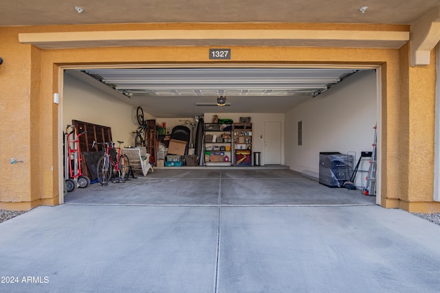 garage featuring electric panel and a garage door opener