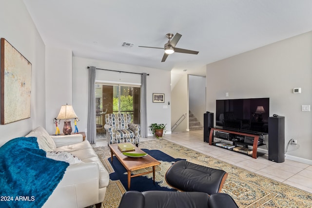 living room with ceiling fan and light tile patterned flooring