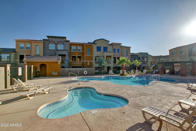 view of swimming pool with a patio