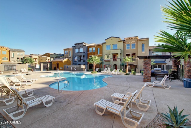 view of swimming pool featuring a patio