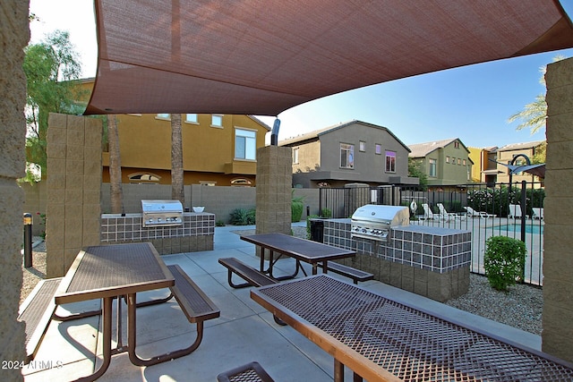 view of patio / terrace featuring an outdoor kitchen and grilling area