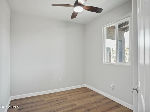 empty room with wood-type flooring and ceiling fan