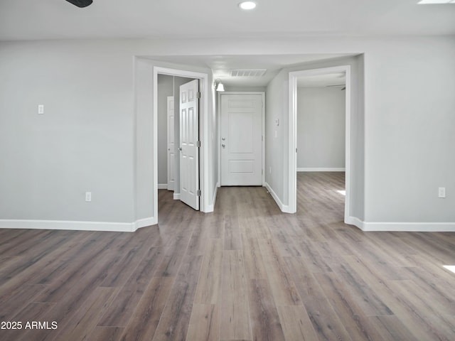 unfurnished room with hardwood / wood-style floors