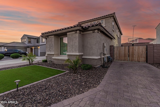 view of front of home with a lawn