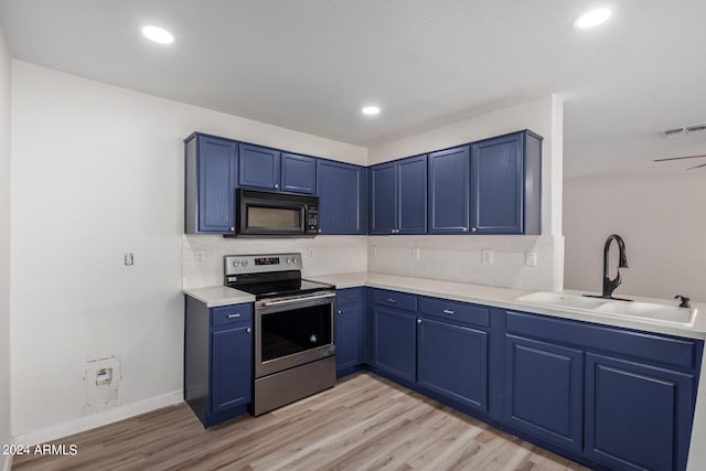 kitchen with blue cabinetry, light hardwood / wood-style flooring, stainless steel electric range, and sink