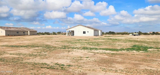 view of yard with a rural view