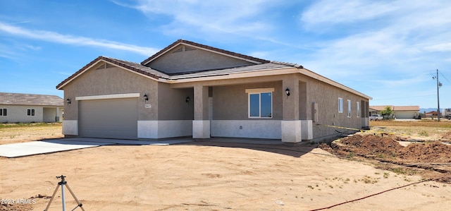 view of front of home with a garage