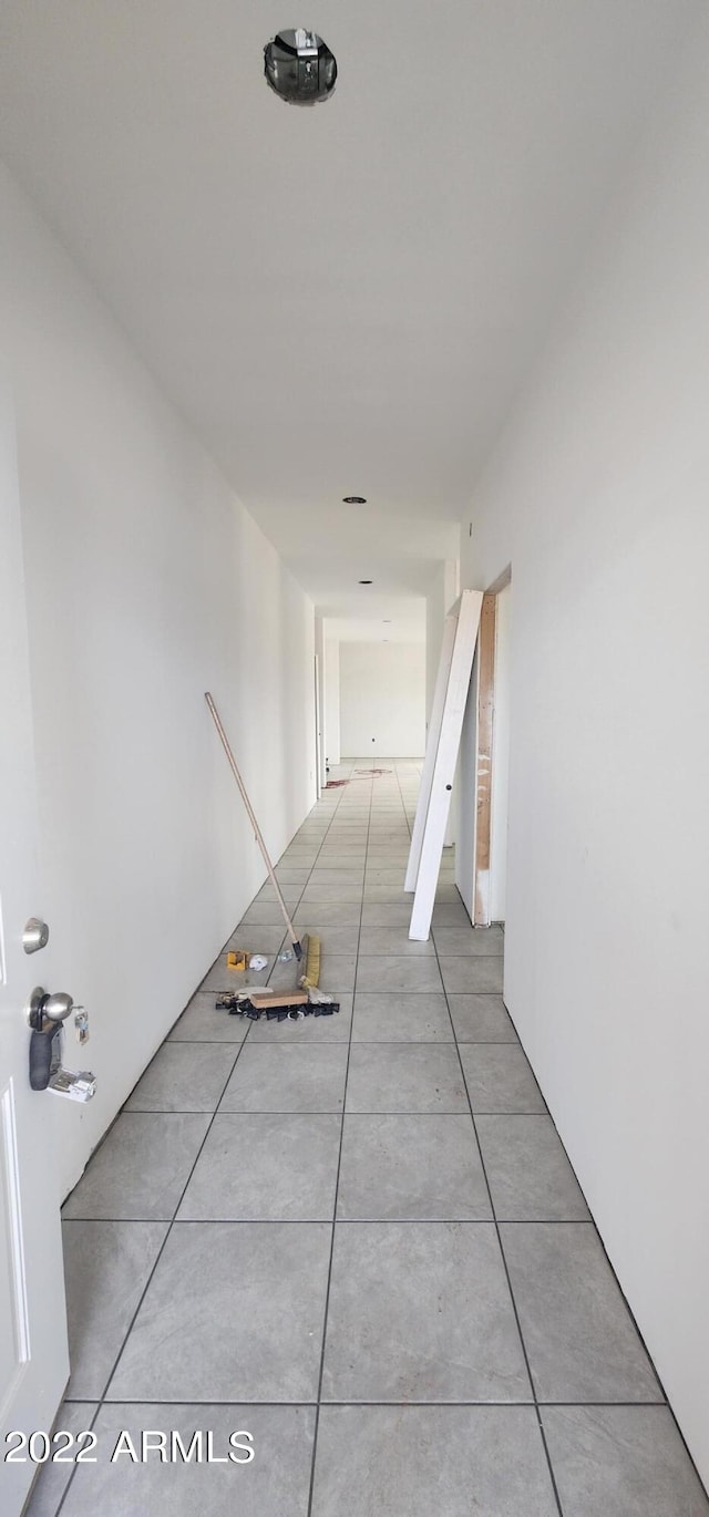 corridor with light tile floors