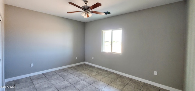 tiled empty room with ceiling fan