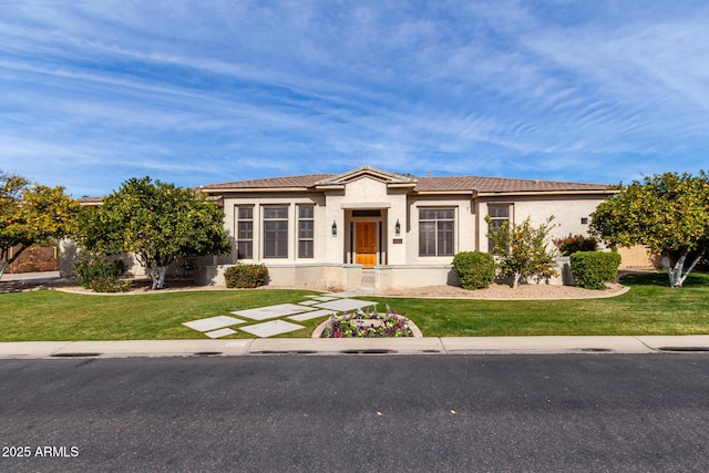 view of front of home with a front lawn