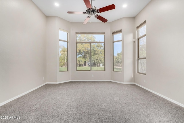 unfurnished room with ceiling fan, carpet floors, and a healthy amount of sunlight