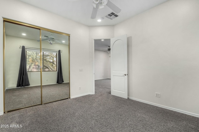 unfurnished bedroom featuring carpet floors, ceiling fan, and a closet