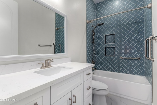 full bathroom with tiled shower / bath, vanity, toilet, and tile patterned floors