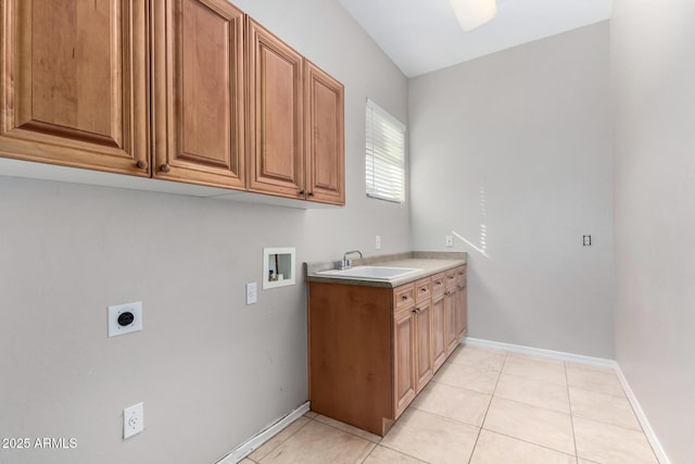 laundry room with light tile patterned flooring, sink, cabinets, electric dryer hookup, and washer hookup