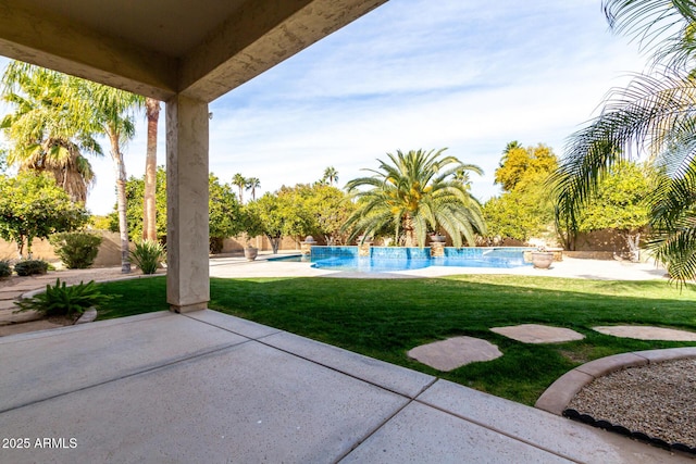 view of yard featuring pool water feature and a patio