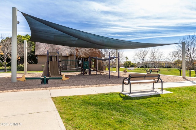 view of jungle gym featuring a lawn