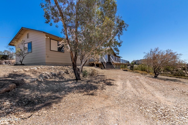 48451 N 27th Ave, New River, AZ 85087 - view of home's exterior featuring stairway, driveway, and a porch
