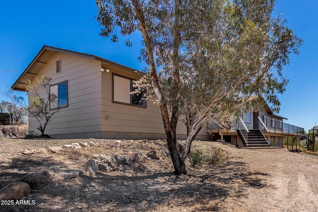 48451 N 27th Ave, New River, AZ 85087 - view of home's exterior featuring stairway and a wooden deck