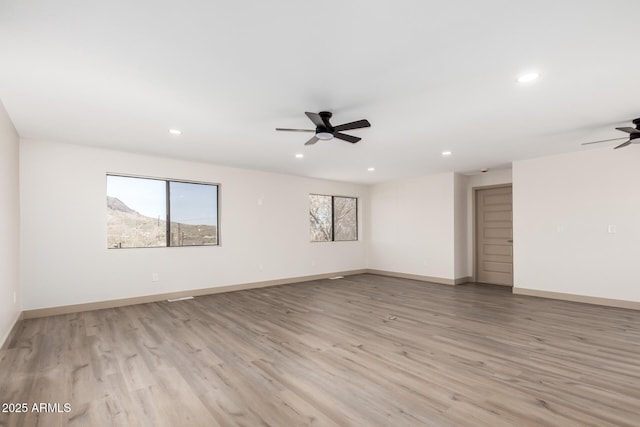 48451 N 27th Ave, New River, AZ 85087 - spare room with ceiling fan, light wood-style floors, recessed lighting, and baseboards