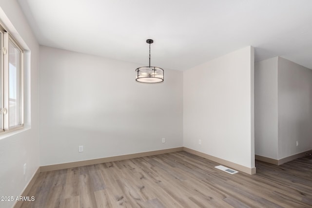 48451 N 27th Ave, New River, AZ 85087 - spare room featuring wood finished floors and baseboards
