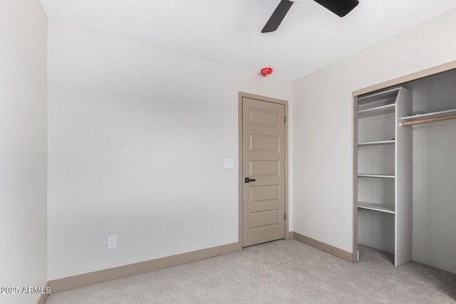 48451 N 27th Ave, New River, AZ 85087 - unfurnished bedroom with carpet, a closet, baseboards, and a ceiling fan