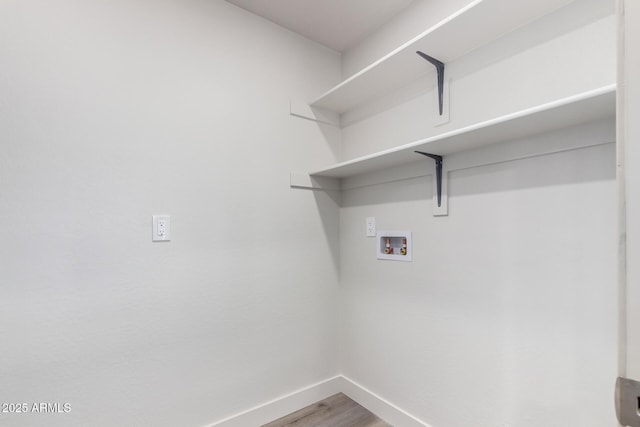 48451 N 27th Ave, New River, AZ 85087 - washroom with baseboards, washer hookup, and wood finished floors