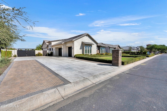 2652 E Pelican Ct, Gilbert, AZ 85297 - ranch-style home featuring a garage, concrete driveway, stucco siding, a gate, and a residential view