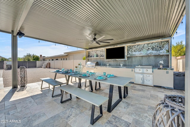 2652 E Pelican Ct, Gilbert, AZ 85297 - fenced backyard with an outdoor kitchen, a patio area, ceiling fan, and outdoor dining space