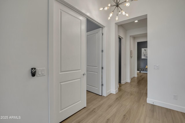 2652 E Pelican Ct, Gilbert, AZ 85297 - hallway featuring a chandelier and light wood-style floors
