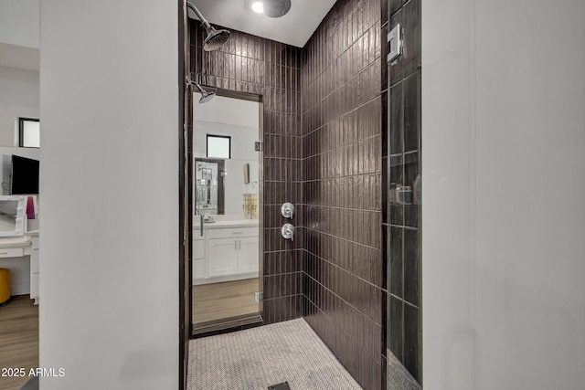 2652 E Pelican Ct, Gilbert, AZ 85297 - bathroom featuring a tile shower, vanity, and wood finished floors