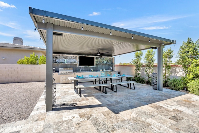 2652 E Pelican Ct, Gilbert, AZ 85297 - fenced backyard featuring ceiling fan, area for grilling, a patio area, and outdoor dining space