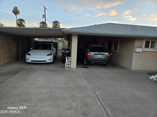 view of parking / parking lot featuring a carport