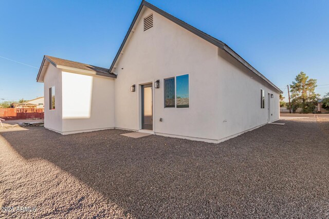 garage with water heater and a garage door opener