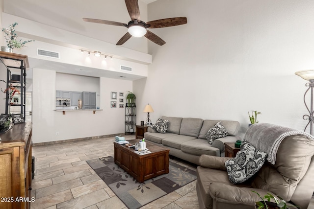 living room with ceiling fan