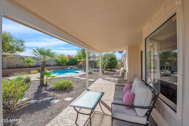 view of patio / terrace with a fenced in pool and a fenced backyard