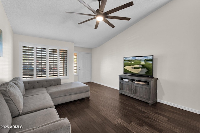 living room with ceiling fan, baseboards, lofted ceiling, dark wood-style floors, and a textured ceiling