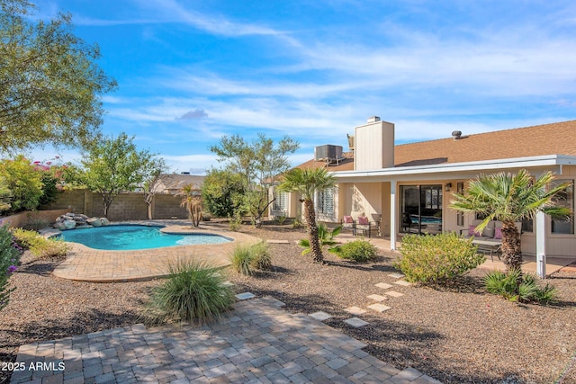 outdoor pool with a patio, central air condition unit, and a fenced backyard