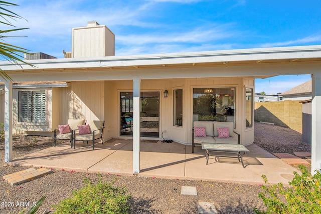 exterior space with a patio, fence, and a chimney