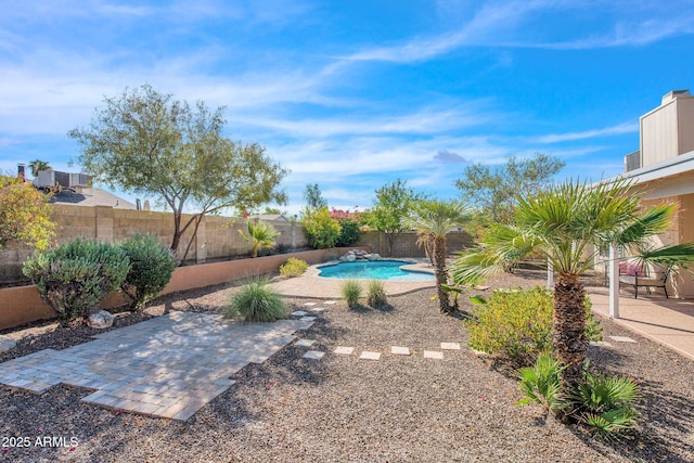 view of swimming pool with a patio, a fenced backyard, and a fenced in pool