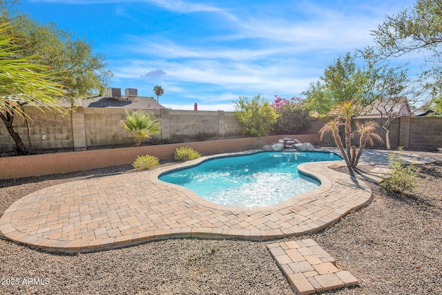 view of swimming pool with a patio area, a fenced backyard, and a fenced in pool