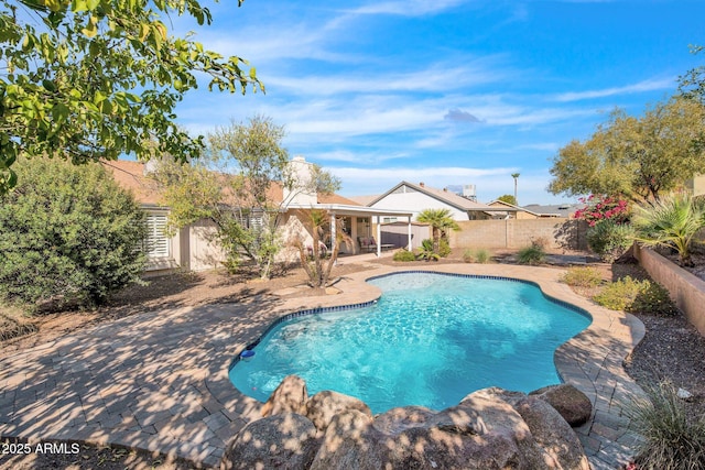 view of pool with a patio, a fenced backyard, and a fenced in pool