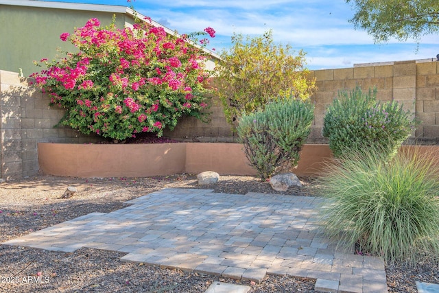 view of patio / terrace featuring fence