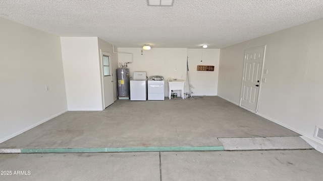 garage with separate washer and dryer, a sink, water heater, and baseboards